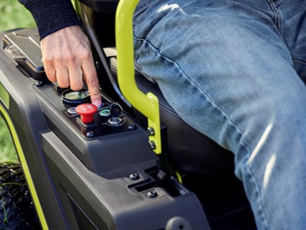 Photo: Armrests, Ergonomic Control Handles, 2 Cup Holders and Included Towing Hitch