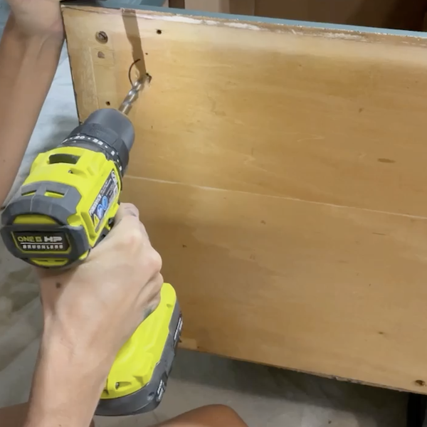 Attaching new feet to the dresser