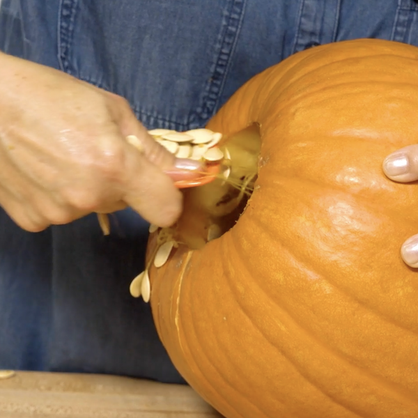 Cleaning out the insides of the pumpkin