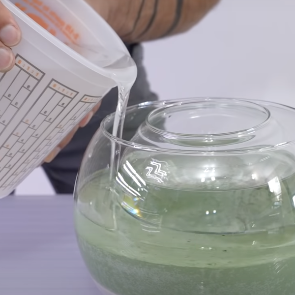 Pouring resin on top of concrete in glass bowl 