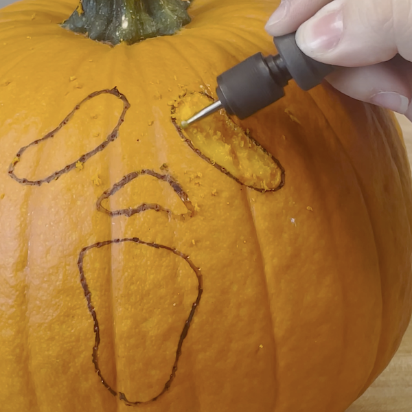 Engraving design into the pumpkin