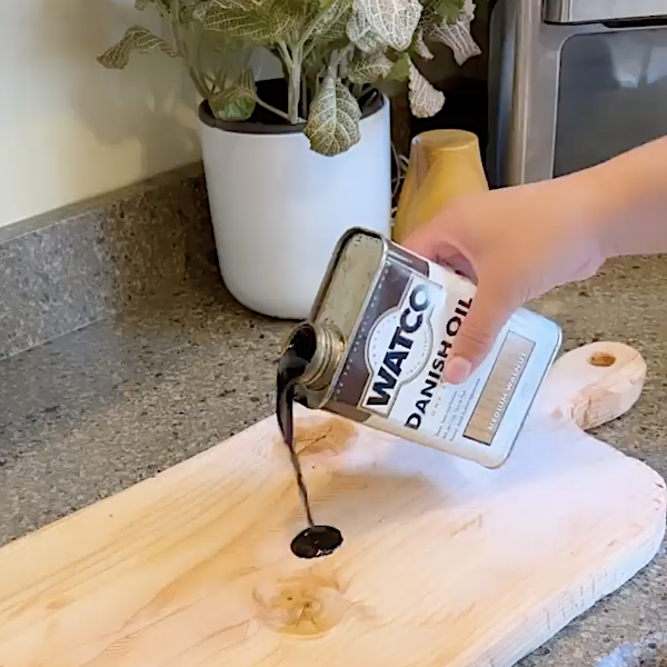 Applying stain to wooden tray