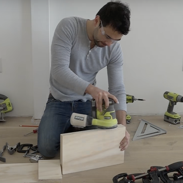 Sanding the edges of the wood