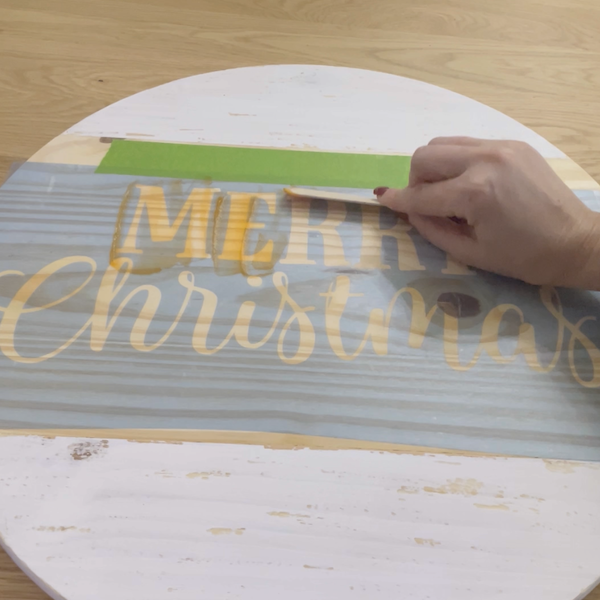 applying torch paste onto sign