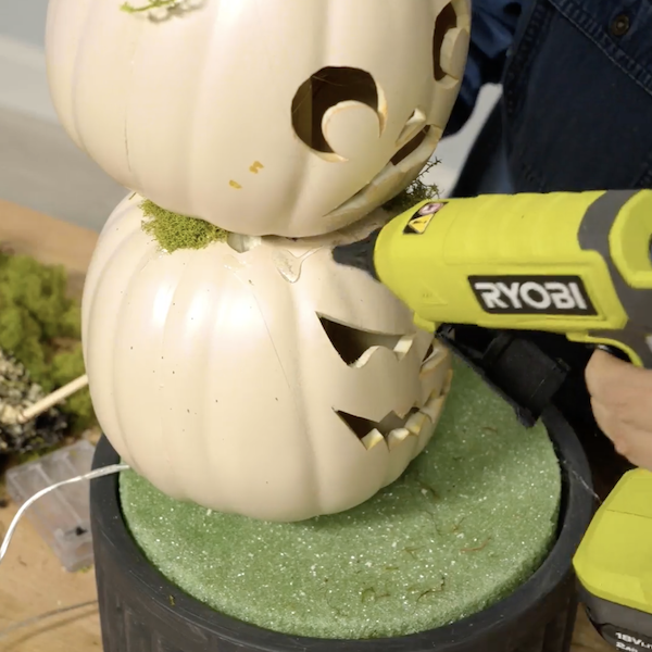 Apply faux moss and decor with hot glue