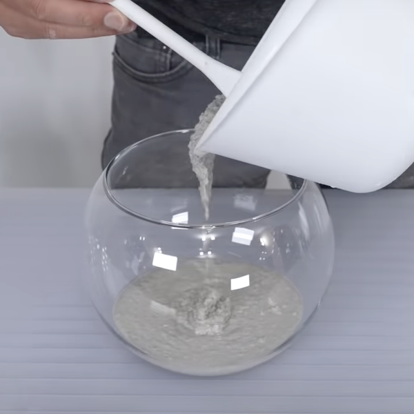 Pouring concrete into bowl