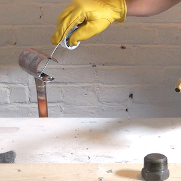 Soldering copper pipe.